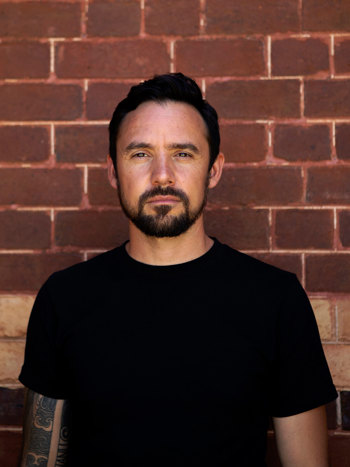 Headshot of James Taylor.