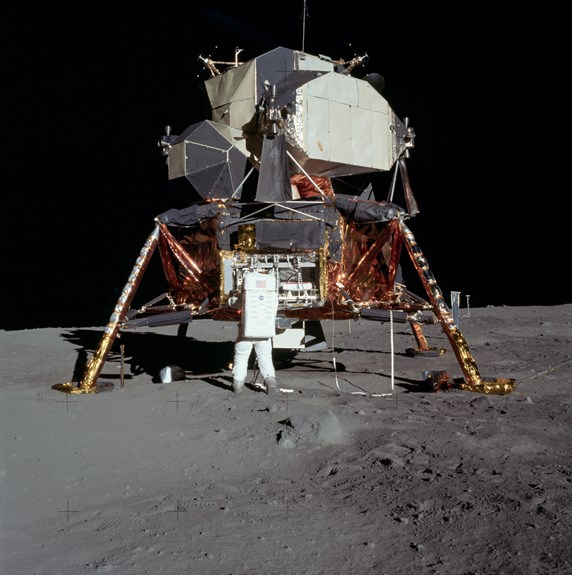 This photograph shows Apollo 11 astronaut Buzz Aldrin in front of the lunar module. The photo helps provide a scale to the LRO image shown above.
