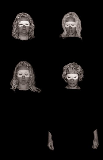 Black-and-white photo of people with faces painted in mourning