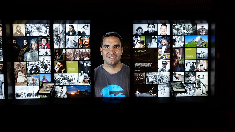 Display panels in the Generations section of First Peoples exhibition at Bunjilaka, Melbourne Museum. In the middle: a portrait of Dale Weegberg.
