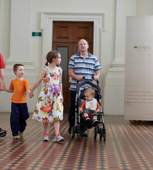 A family walking through Immigration Museum.