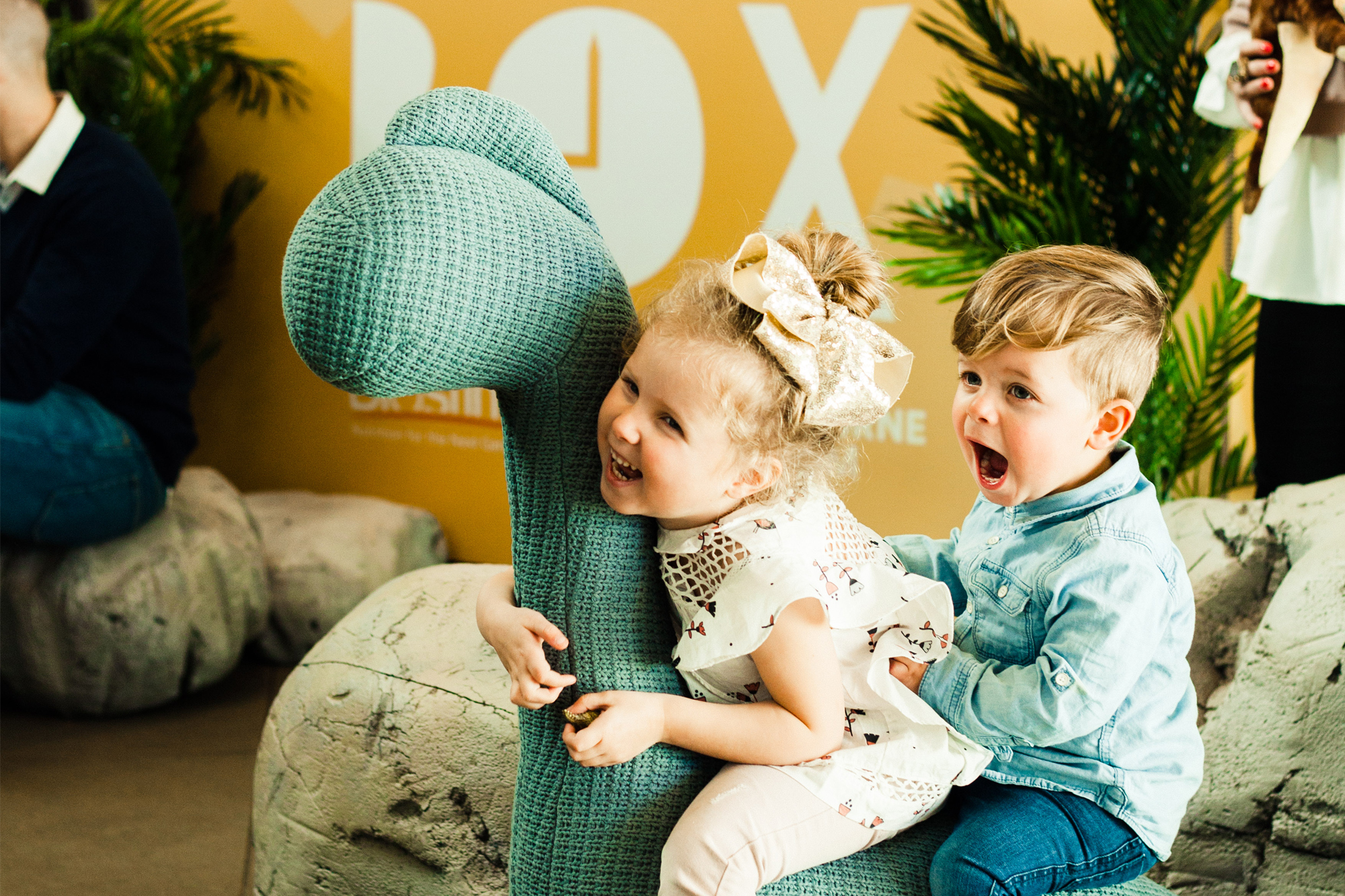Two toddlers playing at Melbourne Museum's Play Box event. 