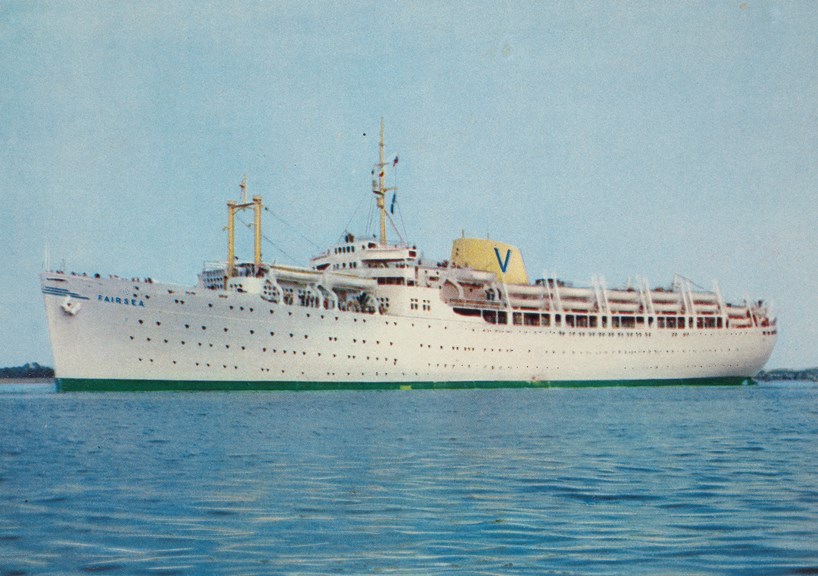 A white passenger ship on blue seas.