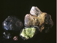 Augite (black rock on left) and Anorthoclase (brown rock at back right)