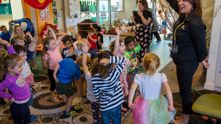 Outreach Program Presenter, presenting the fossil program to kindergarten children.