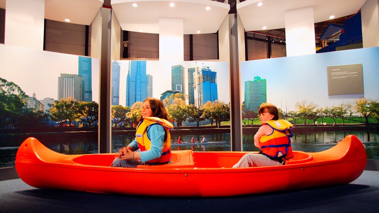 Two girls in a canoe in the Sportsworks exhibition