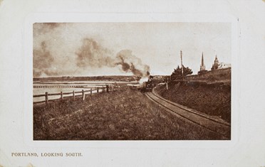 A steam locomotive hauling a passenger train, Portland, post-1910