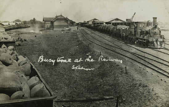 Trains passing through a station, circa 1910