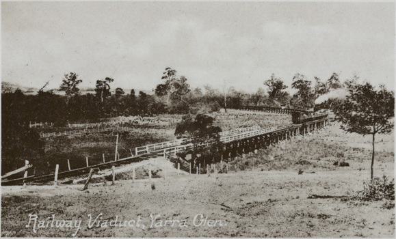 Steam locomotive hauling passenger carriages crossing viaduct, Yarra Glen, pre-28 December 1920