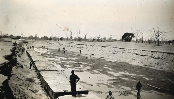 Filled railway trucks at the 65 mile ballast pit, Moama to Balranald line, circa 1923-26