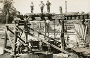 Construction of Pier 3 of the Tambo River Bridge on the Bairnsdale to Orbost line, 1914. The outer timber form for the concrete pour is in place.