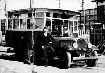A driver posing in Fairfield with his bus, which ran from Fairfield Station to High Street, Northcote, 1926