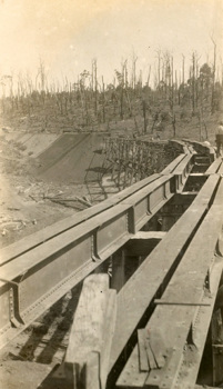 Rail bridge construction, Bairnsdale to Orbost line, circa 1914-15. Girders have been laid on the piers but are still to be fixed in place.