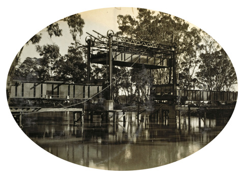 Raising the lift span for the first time during the construction of the Gonn Crossing Bridge, on the Murrabit to Stony Crossing line, 1928