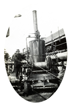 Mitchell River Bridge on the Bairnsdale to Orbost line, circa 1914. Donkey engine with a temporary bridge in the background