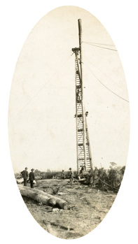 Bridge over the Nicholson River, Bairnsdale to Orbost line, circa 1915. An 80 ft test pile is being lifted into position by a pile-driving derrick.