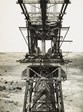 A front view of the travelling crane on top of one of the towers of the Maribyrnong River Viaduct on the Albion to Broadmeadows line, Keilor East, 1928