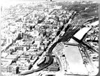 Aerial view of Melbourne and the Yarra River, showing the viaduct at Flinders Street Station and Jolimont Yards, 1968