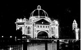 Flinders Street Station illuminated for the Prince of Wales' visit, 1920