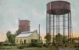 Two large water towers and a weatherboard building, Kerang, post-1900