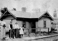 Gatekeeper and family in front of their home, at a railway level crossing, Newport, circa 1905