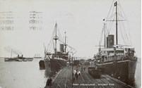 Rail trucks and two large ships berthed at Railway Pier (Station Pier), Port Melbourne, pre-5 November 1923