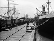 Loading wheat from rail trucks to boats, Williamstown Pier