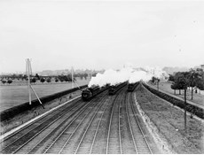 Three E class steam locomotives (nos. 504, 492 and 486) hauling suburban passenger trains bound variously for Sandringham, Oakleigh and Box Hill