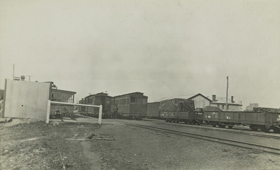 Passenger and goods carriages at an unidentified railway station or siding, post-1910
