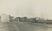 Passenger and goods carriages at an unidentified railway station or siding, post-1910