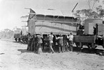 Loading portable huts onto rail trucks, Millewa district, 1924