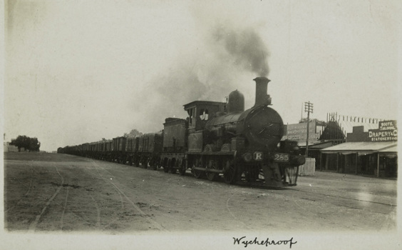 Goods train passing through Wycheproof, circa 1930. Steam engine is no. R 285.
