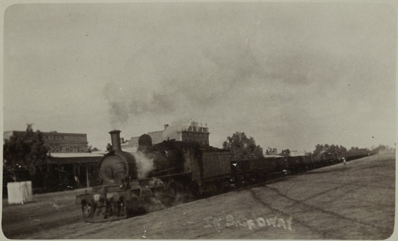Steam locomotive passing the Wycheproof Hotel, circa 1930