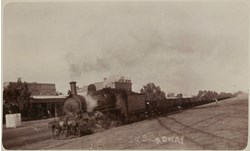 Steam locomotive passing the Wycheproof Hotel, circa 1930
