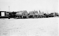 Unloading bags of grain at Hunter Railway Station, circa 1928