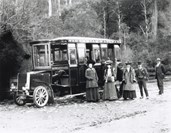 Victorian Railways no. 1 steam bus, parked in front of a post and rail fence on the side of an unsealed forest range, Dandenong Ranges, circa 1901