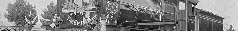 Decorated class D locomotive no. 66, used for transporting soldiers from Ballarat to Geelong, 1916. The sign on the front of the locomotive reads "Australia for the Empire".