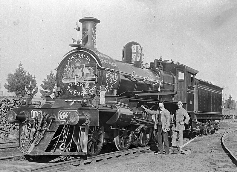 Decorated class D locomotive no. 66, used for transporting soldiers from Ballarat to Geelong, 1916. The sign on the front of the locomotive reads "Australia for the Empire".