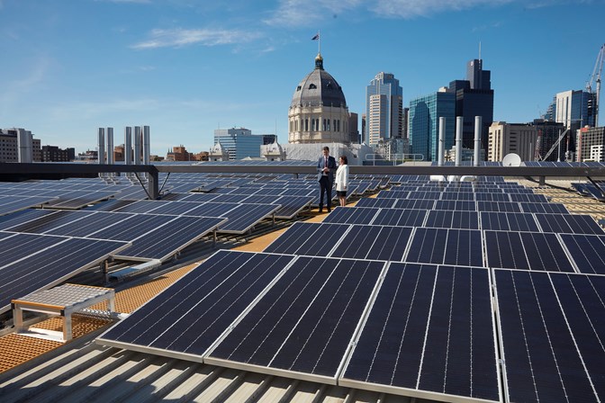 The Hon. Robin Scott, Assistant Treasurer and The Hon. Lily D'Ambrosio, Minister for Energy, Environment and Climate Change, on the Melbourne Museum roof among the 2,700 new solar panels.