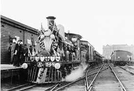 AA class steam locomotive no. 548 decorated for a visit by the Duke and Duchess of Cornwall and York to open the Australian Parliament, May 1901