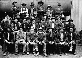 Bendigo workshop staff posed in front of a steam boiler, 1911