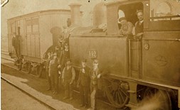 Loco crew with passengers and staff, circa 1910