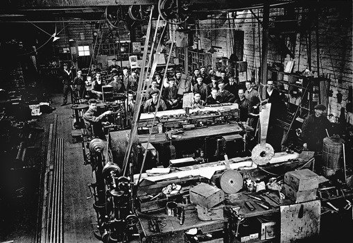 Workers on the factory floor in a railway workshop, Melbourne, 1927