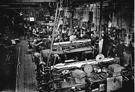 Workers on the factory floor in a railway workshop, Melbourne, 1927