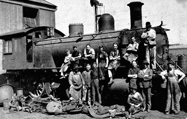 Staff maintaining a locomotive, Newport railway workshop, circa 1925