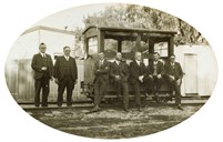 Seven members of the engineering staff from the Railway Construction Branch on an inspection trolley while two stand beside, Yarrawonga, 1932