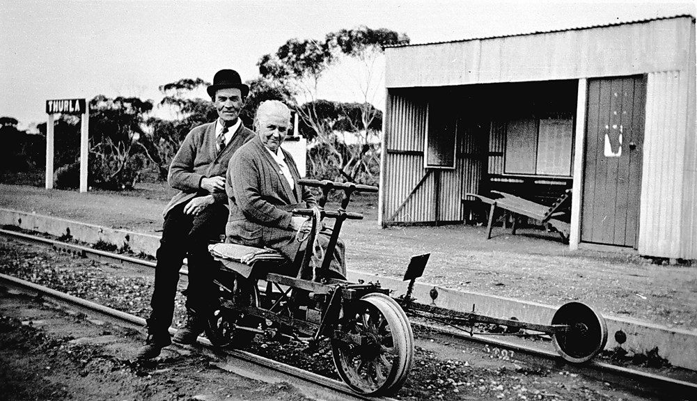 Stationmistress and ganger – a married couple –seated on a ganger's trolley at Thurla Railway Station, circa 1929
