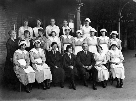 A group of 21 refreshment room staff pose on the platform at Bendigo Railway Station where Mondays were a very busy morning with passenger trains arriving from Echuca, Swan Hill, Heathcote, Cohuna, Robinvale and Kulwin, circa 1929