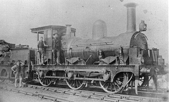 Locomotive crew with steam locomotive, circa 1885