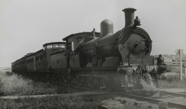 Driver leaning out of the doorway of Y class steam locomotive no. 397, Glen Iris, circa 1922